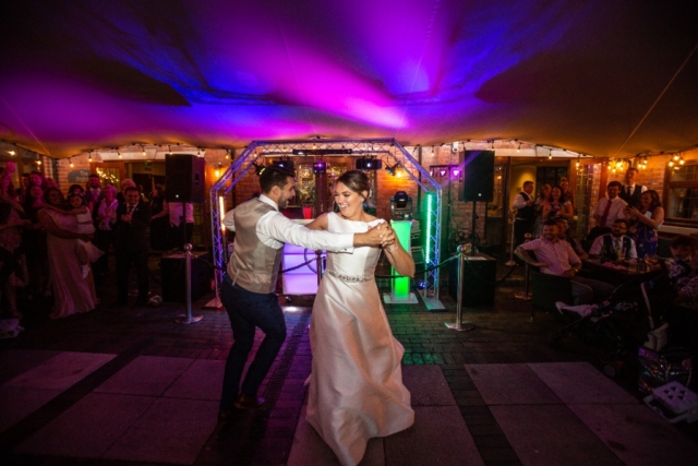 Nuthurst Grange -Wedding couples dance outside the Stables