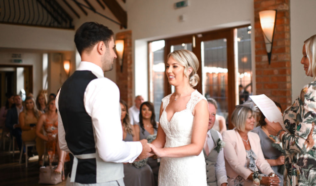 Wedding couple holding hands at Nuthurst Grange Hotel