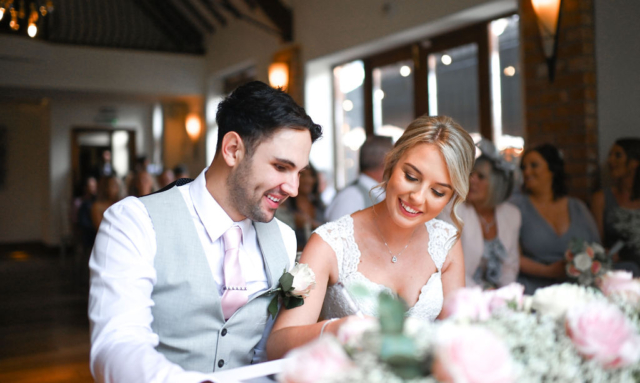 Wedding couple smiling at Nuthurst Grange