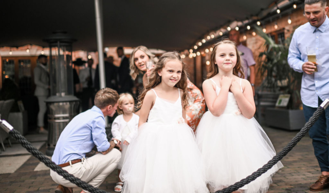 Children smiling outside of the Stables at Nuthurst Grange